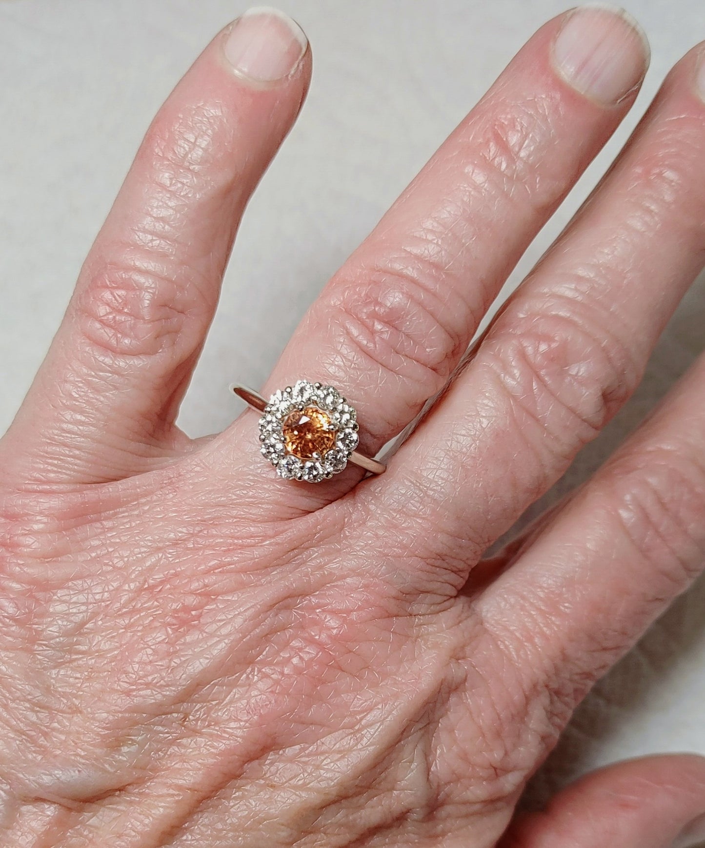 14K White Gold Diamond Halo Ring set with Orange Sapphire