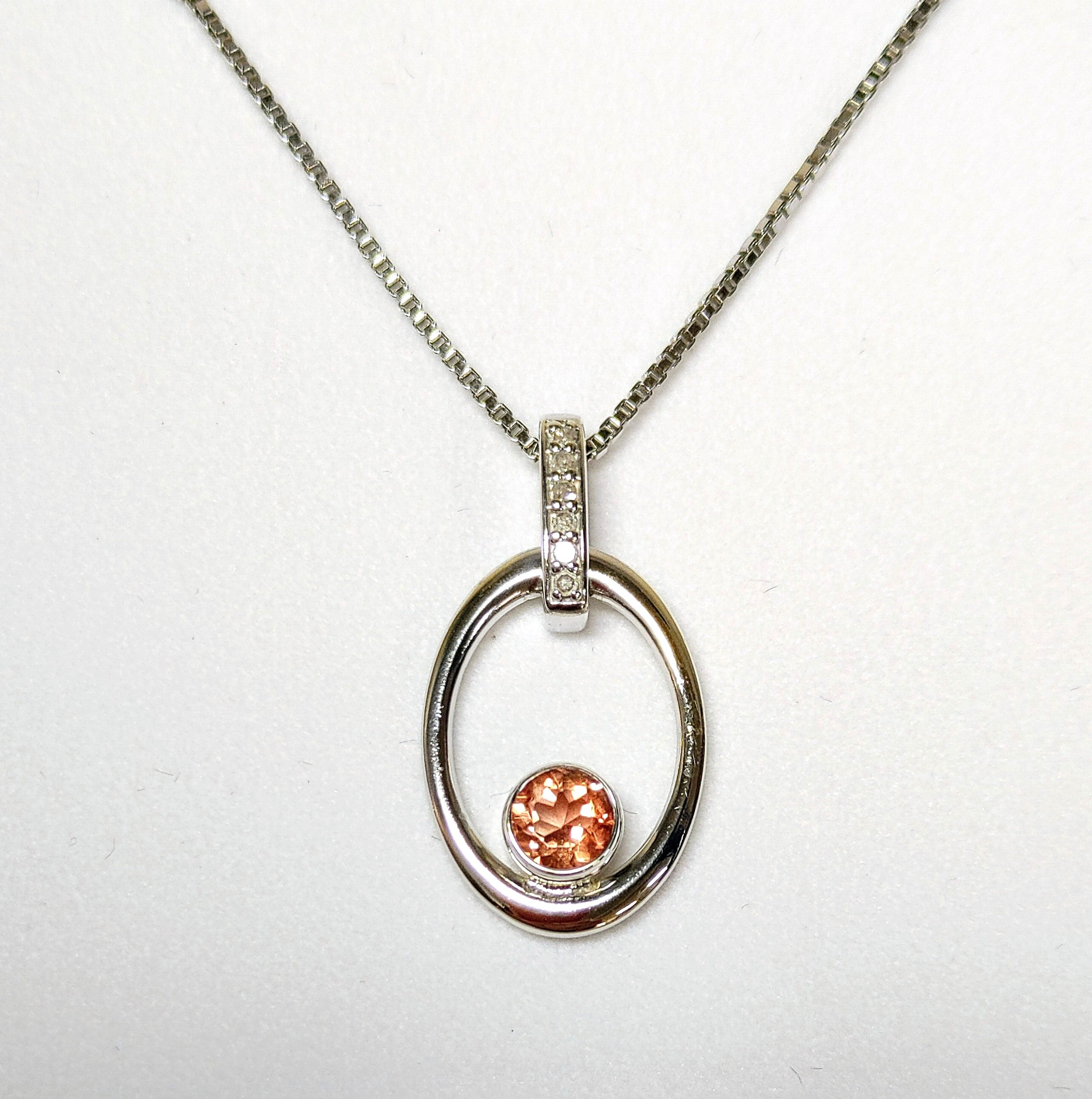 Sunstone (4.20 ct.) and White Topaz Pendant with 20