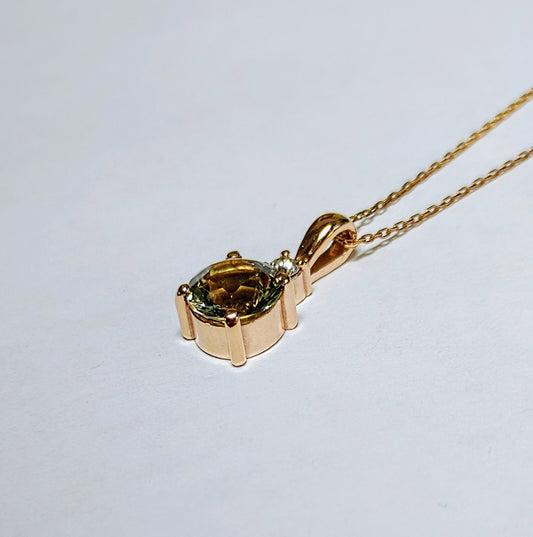 Rare Green Oregon Sunstone set in Rose Gold with diamond.