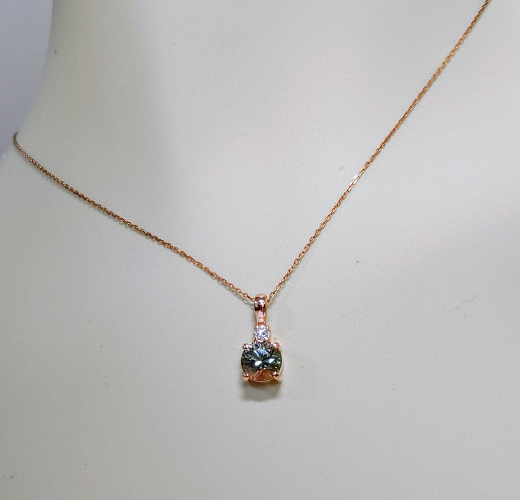 Rare Green Oregon Sunstone set in Rose Gold with diamond.