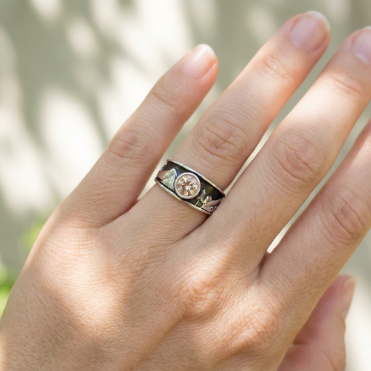 Model wearing the Oregon Wonderland Engagement Ring on the ring finger, casually posed outdoors with soft sunlight, showcasing its delicate craftsmanship.