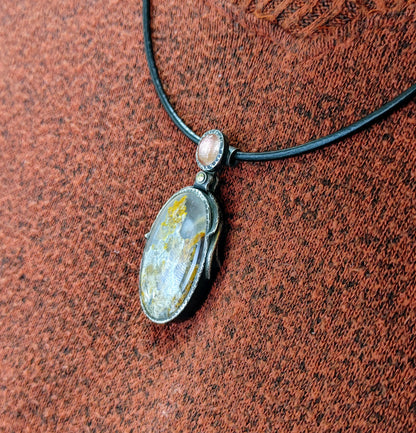 "Sunstone Nebula" Pendant-Plume Agate with Oregon Sunstone set in Sterling Silver.