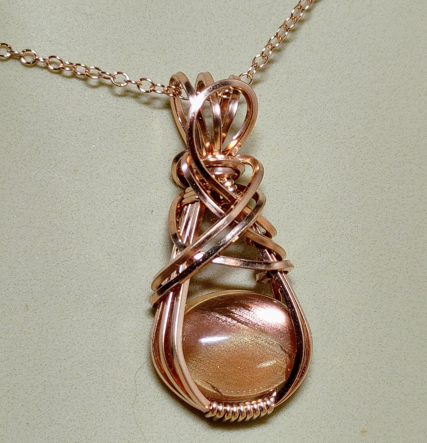 Sunstone-Rose Gold, Wire Wrap Pendant, Oval Peach Schiller Cabochon