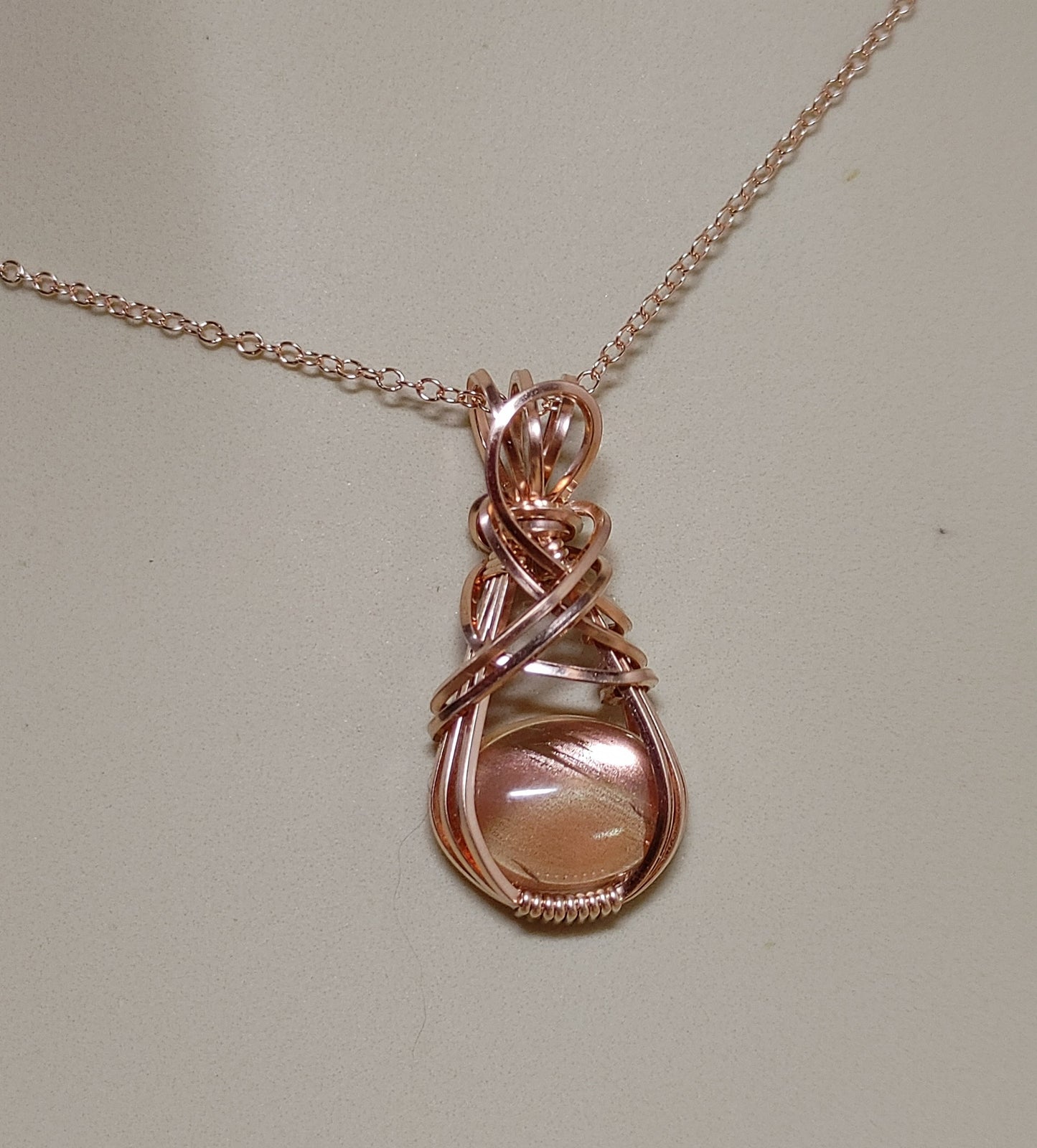 Sunstone-Rose Gold, Wire Wrap Pendant, Oval Peach Schiller Cabochon