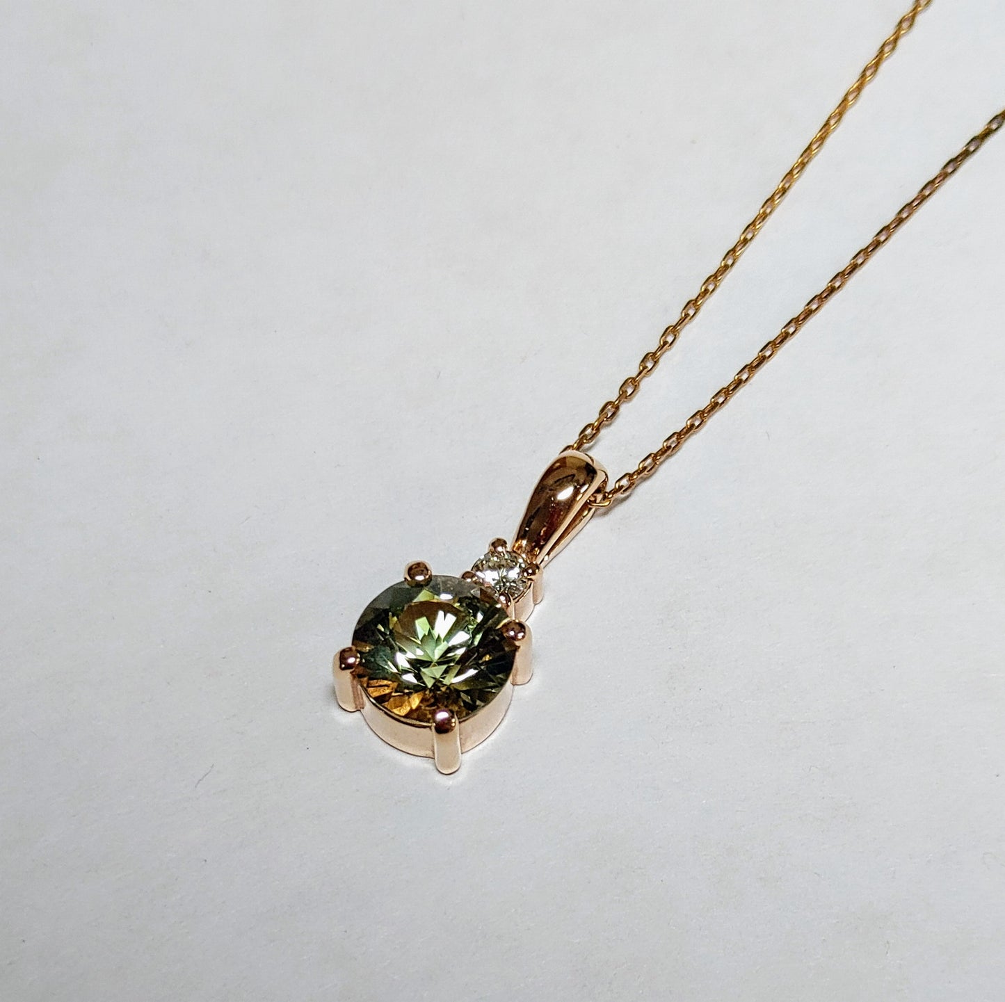 Limited Edition Necklace! Rare Green Oregon Sunstone set in Rose Gold with diamond.