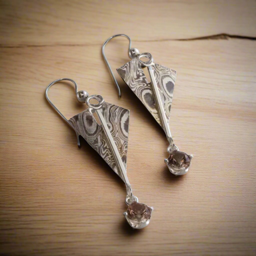 Mokume Sunstone dangle earring on ear